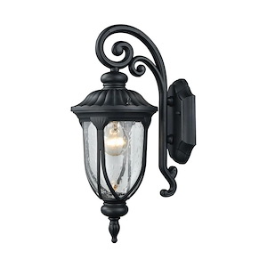 1 Light Traditional Large Outdoor Wall Light with Exposed Bulb Behind Seedy Glass and a Black Scalloped Scrolled Arm
